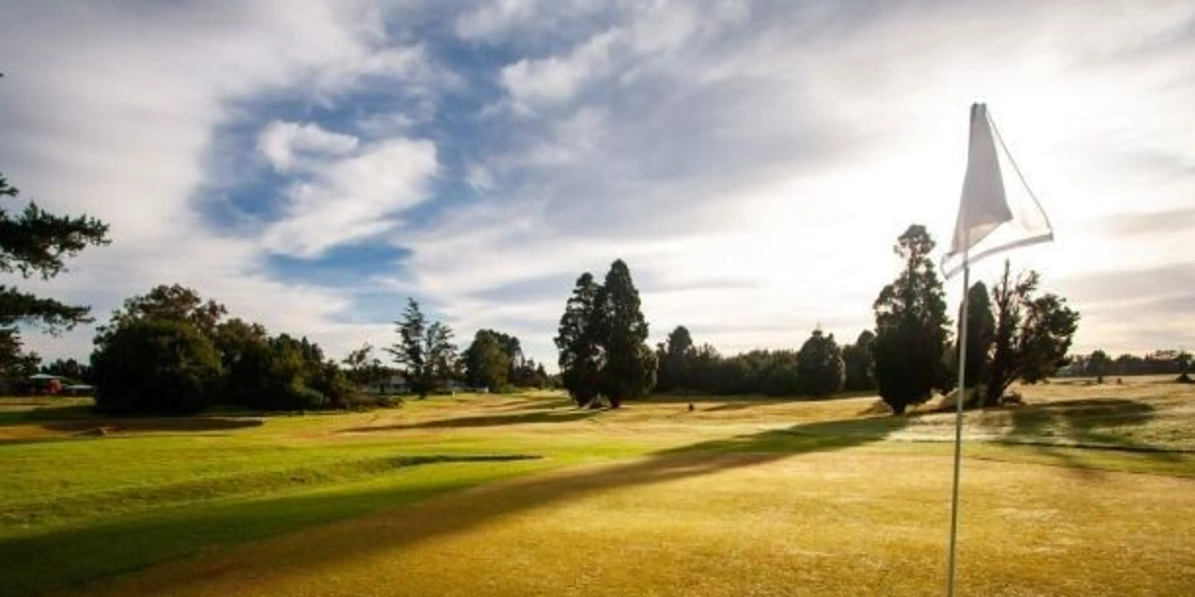 Landscape putting greens and fairway photo of the Volcano Golf Course golf course