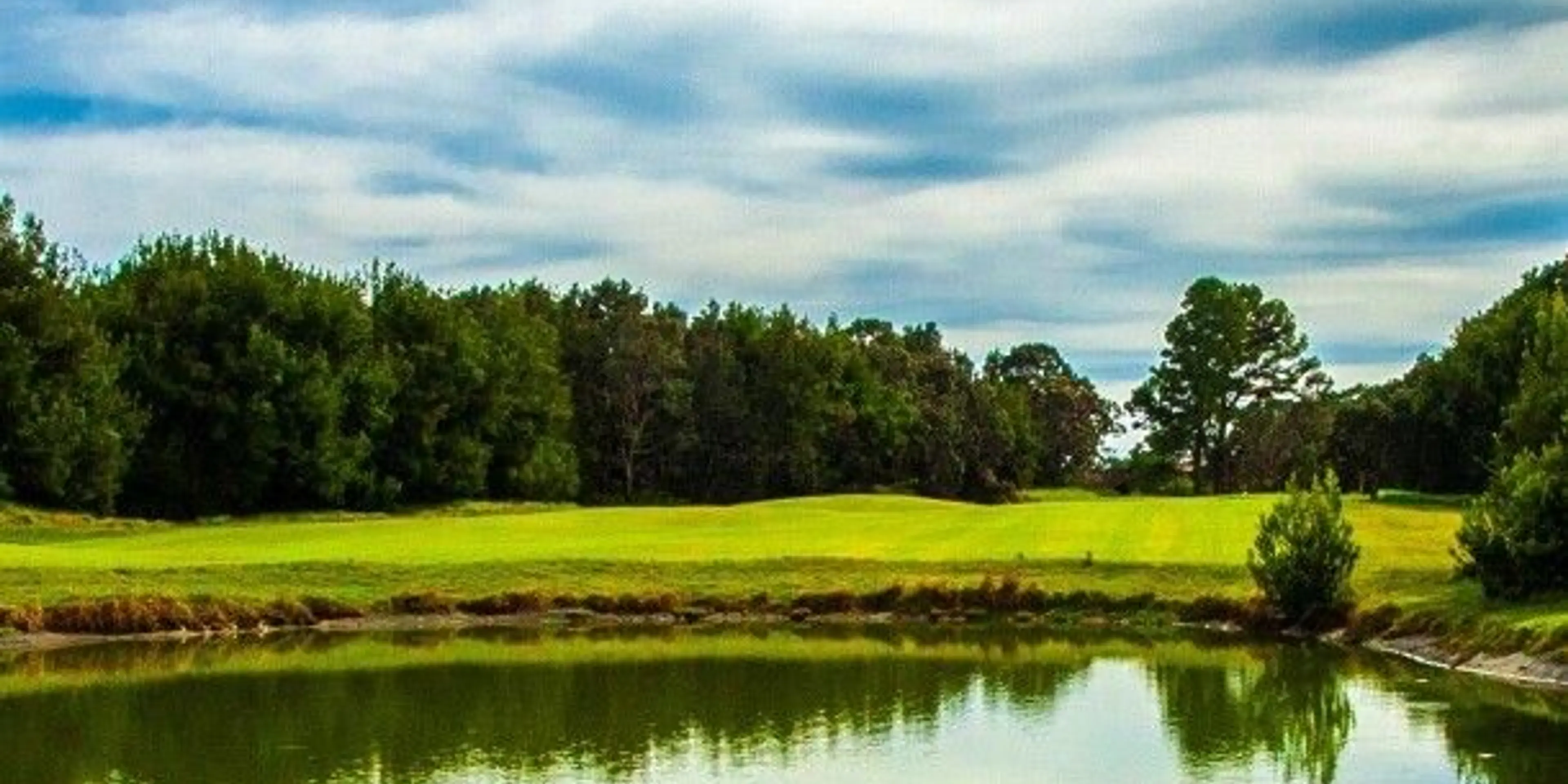 Landscape putting greens and fairway photo of the Volcano Golf Course golf course