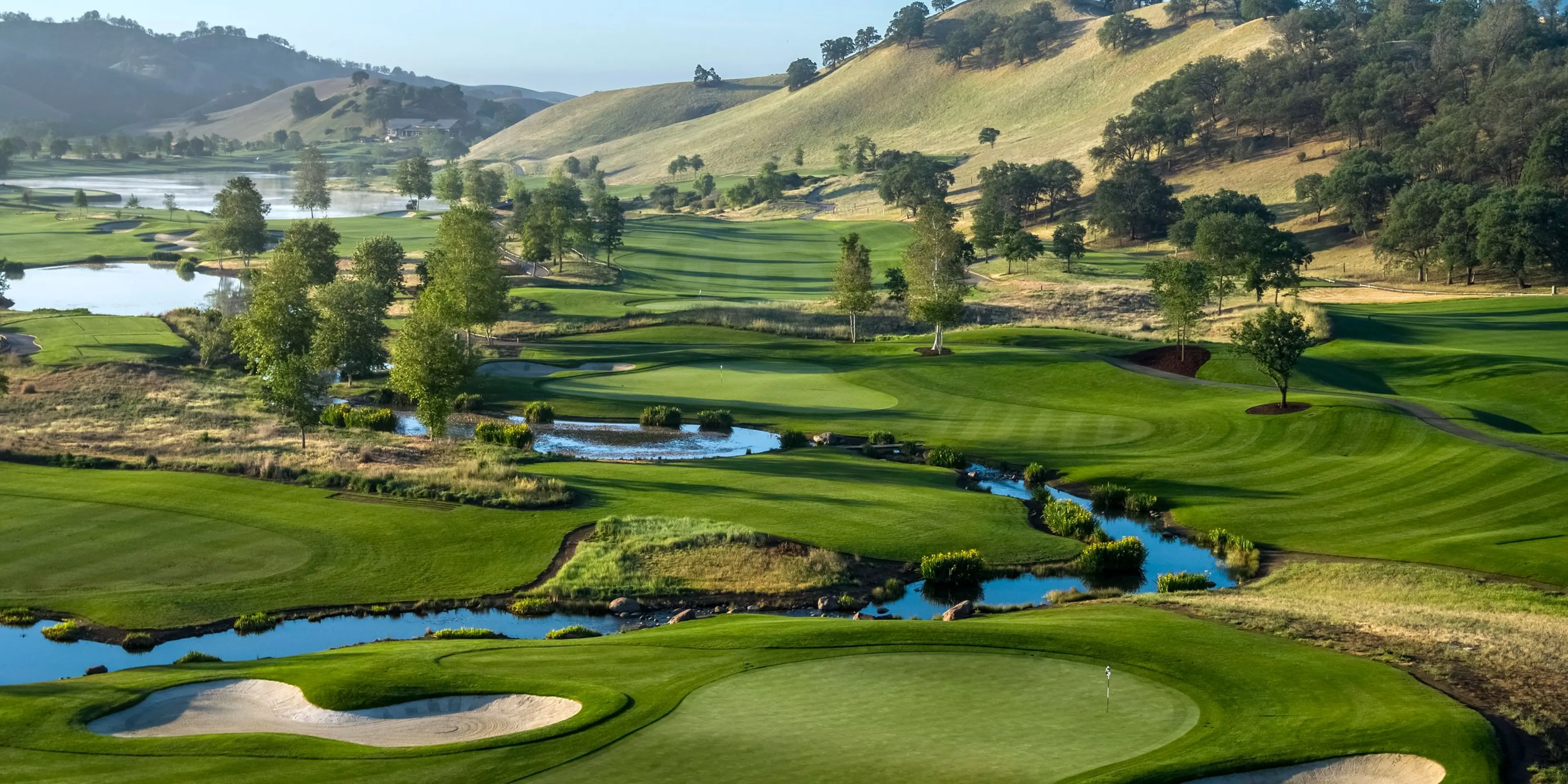 Landscape putting greens and fairway photo of the Yocha Dehe Golf Club golf course