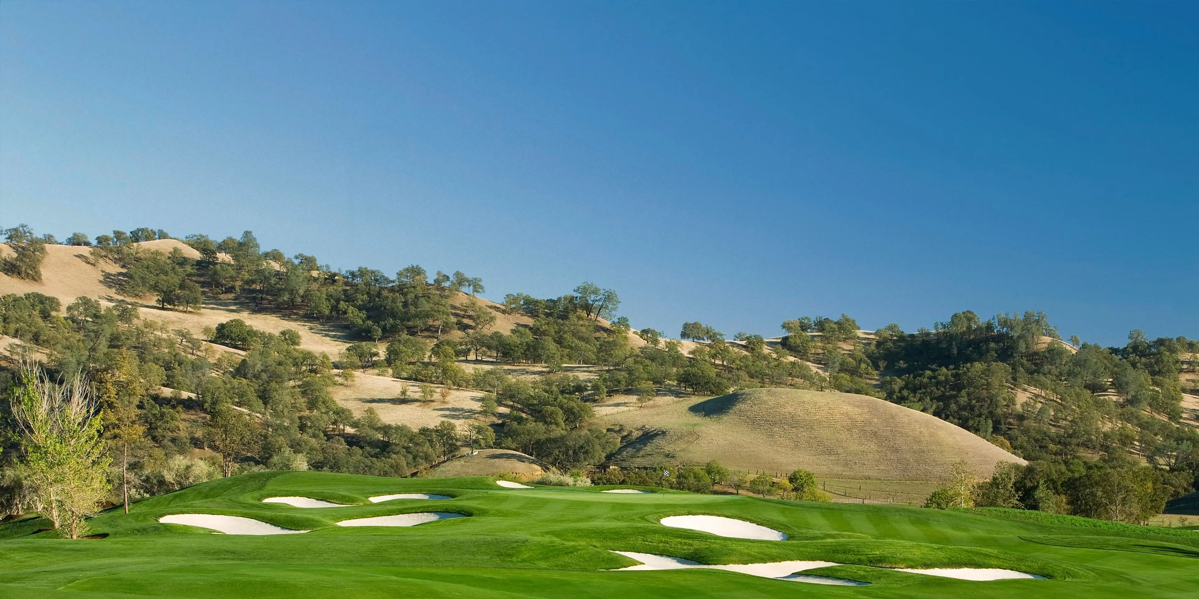 Landscape putting greens and fairway photo of the Yocha Dehe Golf Club golf course