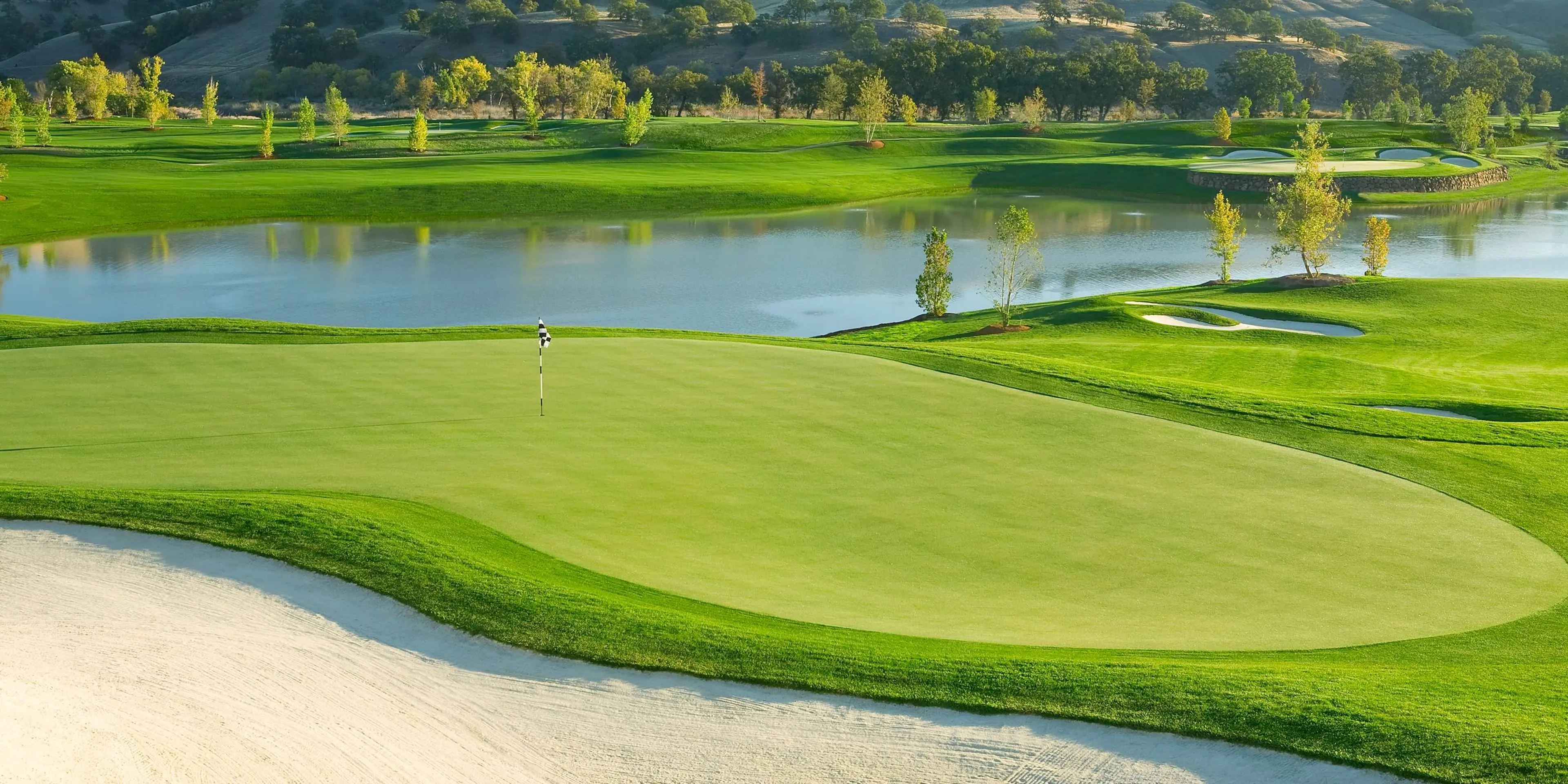 Landscape putting greens and fairway photo of the Yocha Dehe Golf Club golf course