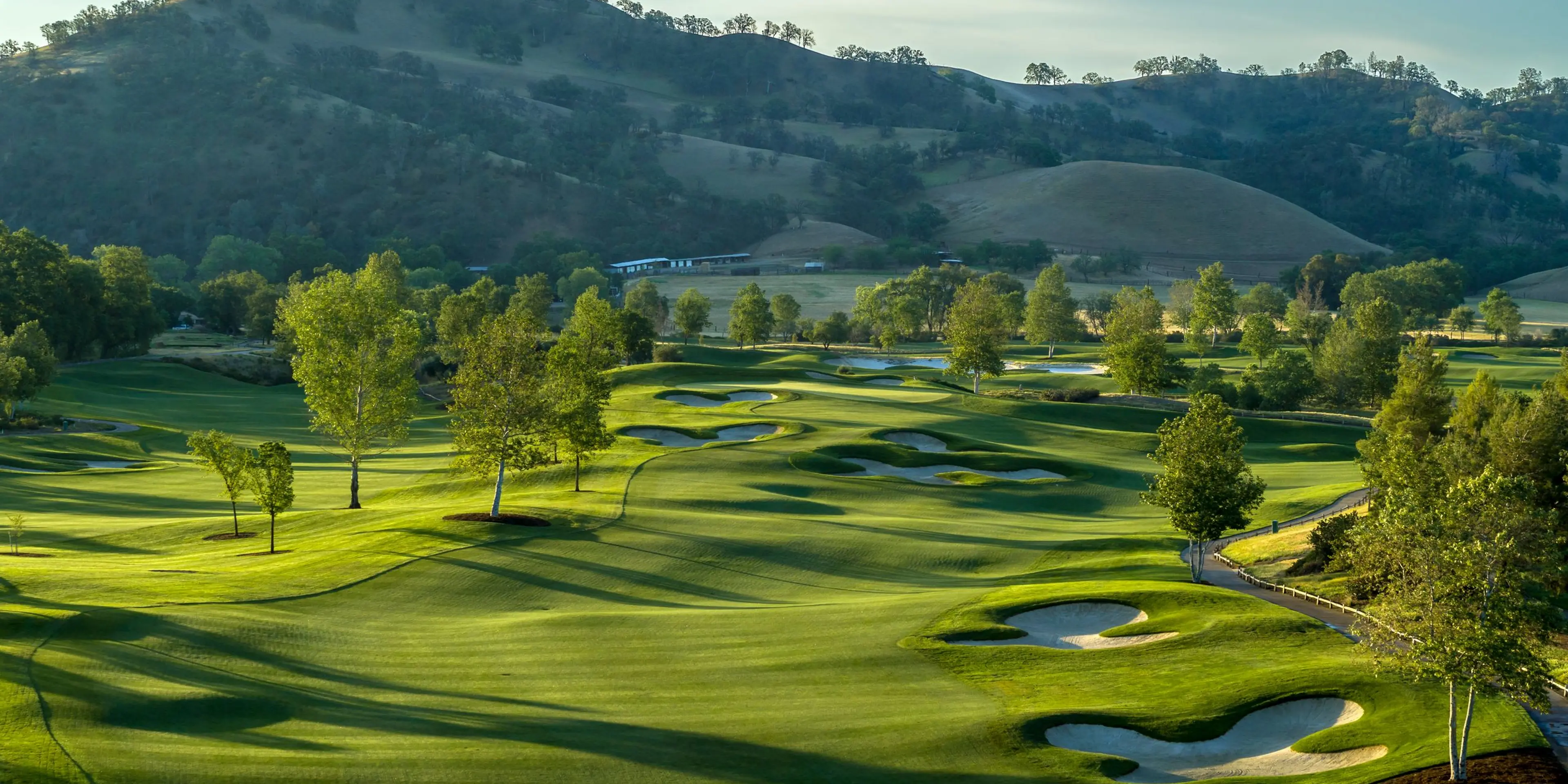 Landscape putting greens and fairway photo of the Yocha Dehe Golf Club golf course